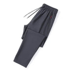 Mandotos men's casual slim fit jogger pants with elastic waist in blue, black, and gray, featuring a classic Korean style.