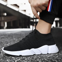 Men's cushioned running shoes by MANDOTOS with breathable mesh upper and supportive sole for comfort and performance.