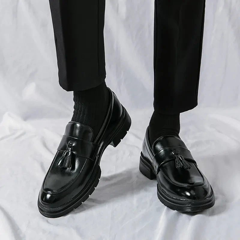 Men's elegant breathable tassel loafers by MANDOTOS, featuring sleek design and comfortable fit, shown in a stylish close-up image.