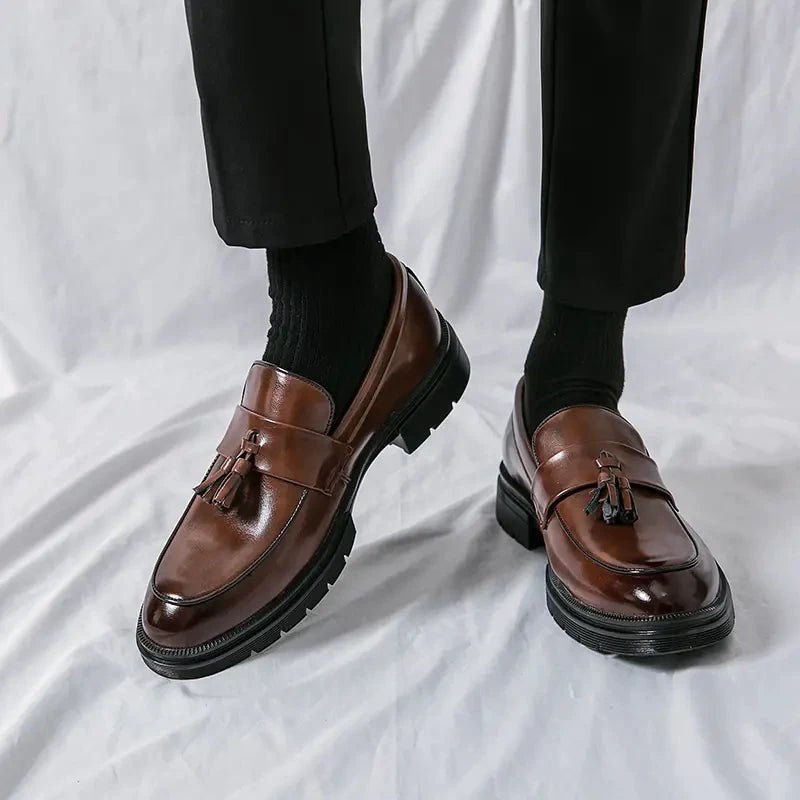 Men's elegant breathable tassel loafers by MANDOTOS, showcasing sleek design and comfortable leather upper with tassel details.