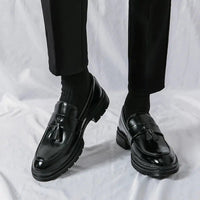 Men's elegant breathable tassel loafers by MANDOTOS, showcasing stylish leather loafers with tassel details on a neutral background.
