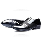 Men's formal shoes by MANDOTOS featuring sleek black leather design and classic lace-up style for sophisticated look.