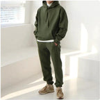 Men's hooded sports sweatshirt by MANDOTOS, showing a comfortable gray sweatshirt with front pockets and a drawstring hood.