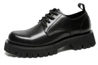 Men's leather Martin shoes with thick cushioned soles by MANDOTOS, featuring sleek black design and sturdy lace-up style.