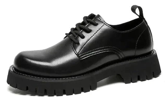 Men's leather Martin shoes by MANDOTOS with thick cushioned soles, stylish design, and polished black finish.