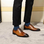 Men's brown leather Oxford shoes by MANDOTOS, featuring sleek design and polished finish for formal occasions.