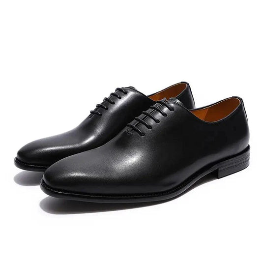 Men's black leather Oxford shoes by MANDOTOS, featuring classic design and polished finish, ideal for formal occasions.