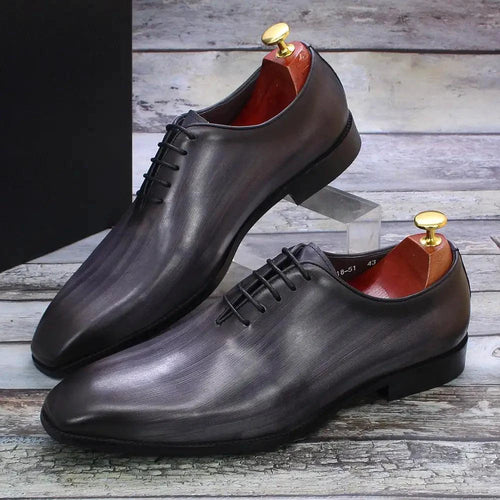 Men's black leather Oxford shoes by MANDOTOS, featuring classic lace-up design and polished finish.