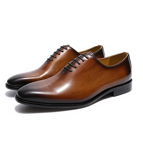 Men's brown leather Oxford shoes by MANDOTOS, featuring classic lace-up design and polished finish for formal style.