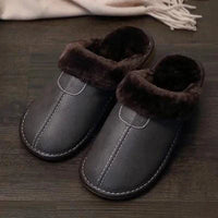 Men's luxury leather slippers by MANDOTOS, featuring soft leather upper and cushioned soles for comfortable indoor wear.