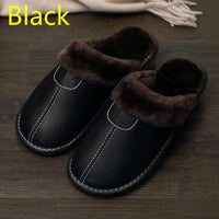 Men's luxury leather slippers by MANDOTOS featuring soft leather upper and comfortable slip-on design.