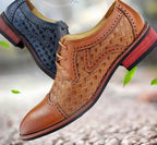 Men's pointed leather dress shoes by MANDOTOS in Korean style, featuring sleek design and polished black leather.