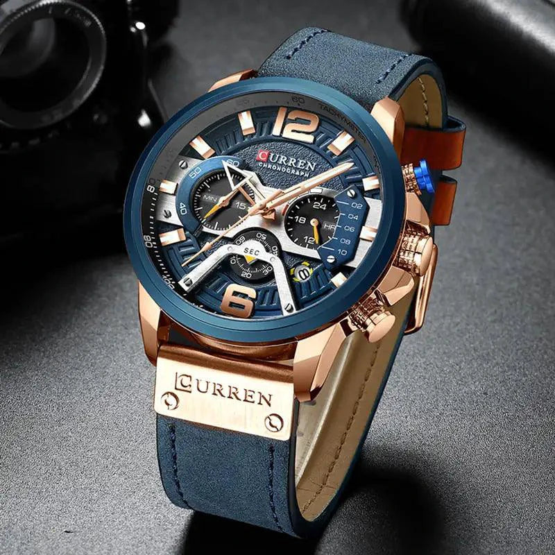 Mandotos military leather chronograph wristwatch with black dial, silver case, and brown leather strap displaying time and chronograph functions.