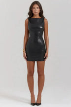 Mini black leather dress by MANDOTOS, featuring a fitted silhouette and stylish design, shown on a model.