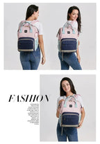 Mandotos Mummy Maternity Bag with multiple compartments and handles, designed for moms to carry baby essentials comfortably.