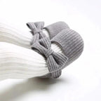 Mandotos newborn soft shoes in pastel colors, featuring soft fabric and gentle sole for comfortable infant wear.