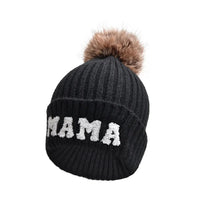 Matching parent-child beanie hats set by MANDOTOS, including three cozy winter knit hats for mama, papa, and baby.