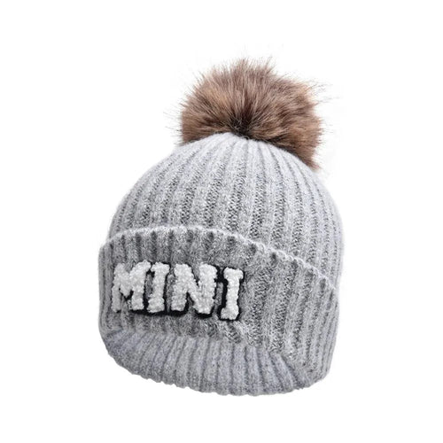 Matching parent-child beanie hats set by MANDOTOS, featuring three cozy winter knit hats for mama, papa, and baby.
