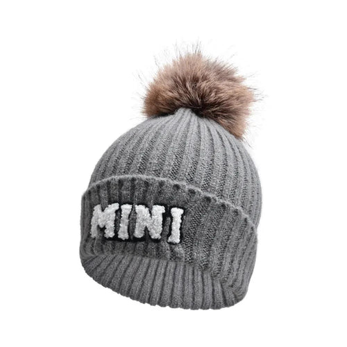 Matching parent-child beanie hats set by MANDOTOS, including three cozy winter hats for mama, papa, and baby.