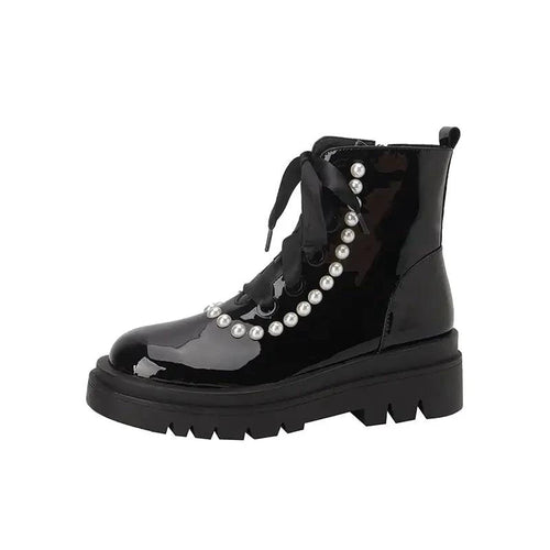 Black patent leather ankle boots from MANDOTOS with sleek design and pointed toes, showcasing stylish footwear for women.