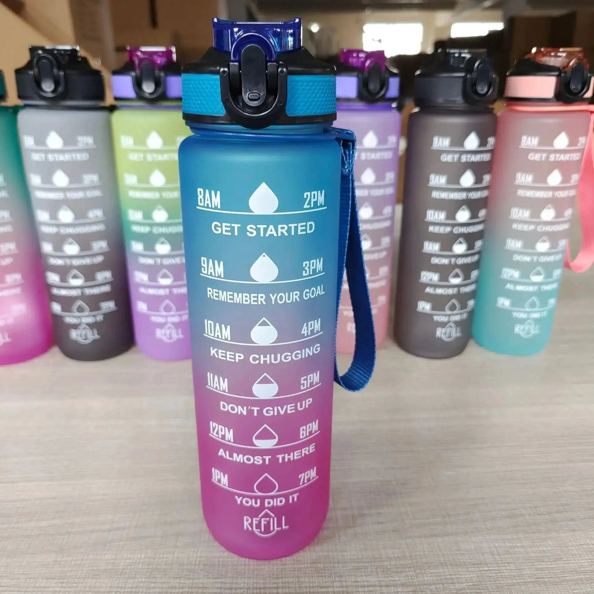 Mandotos PeakHydrate motivational water bottle with colorful design and ergonomic lid for easy drinking.