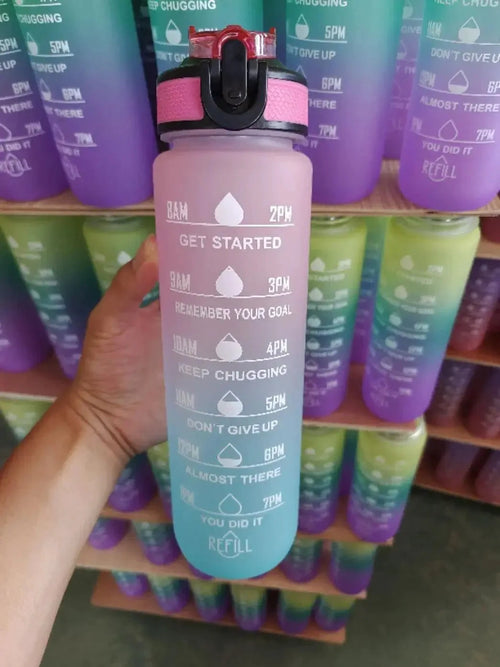 Mandotos PeakHydrate motivational water bottle with colorful design and flip-top lid for hydration on the go