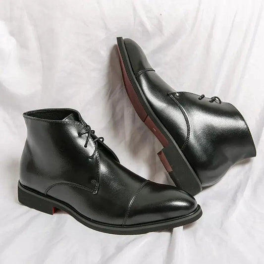 Mandotos red bottom leather boots with sleek design and pointed toes, shown from a side view.