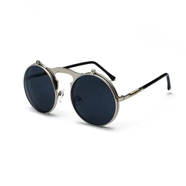Retro flip steampunk sunglasses by MANDOTOS with metal frames and tinted lenses, showcasing a vintage, industrial-inspired design.
