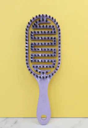 Mandotos ReviveScalp scalp soother comb with ergonomic design for gentle hair and scalp relaxation.