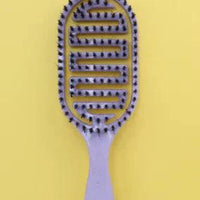 Mandotos ReviveScalp Scalp Soother Comb with ergonomic design for gentle scalp relaxation and hair comfort.
