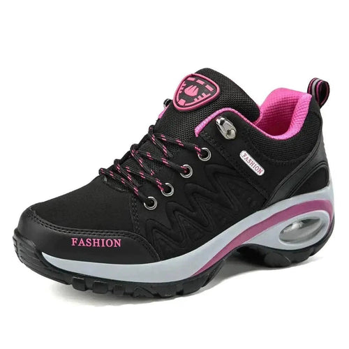Mandotos running shoes in black and white with cushioned soles, designed for comfort and performance during workouts.