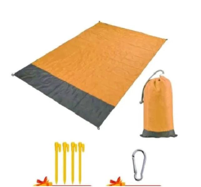Mandotos sandproof portable beach mat spread on sandy shore, lightweight and foldable for easy beach outings.
