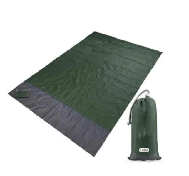 Mandotos sandproof portable beach mat laid out on sandy shore, lightweight and easy to carry for outdoor beach use.
