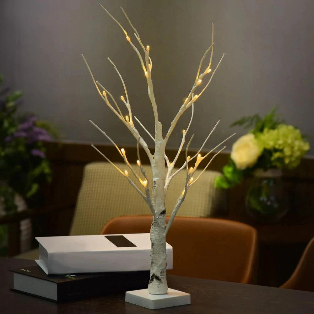 Mandotos Serenity Silver Birch LED light illuminating a cozy space with a soft, warm glow, showcasing its elegant design and natural finish.
