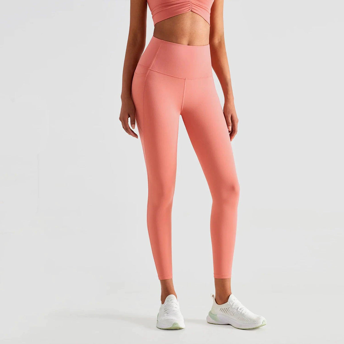 Mandotos ShapeEnhance activewear leggings in black with contouring design, shown on a model for a snug fit and athletic style.