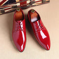 Mandotos sleek leather Oxford shoes showcasing classic design, polished finish, and lace-up style for formal occasions.