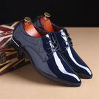 Mandotos sleek leather Oxford shoes with polished finish, classic lace-up design, and elegant craftsmanship for formal wear.