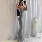 Elegant satin backless gown by MANDOTOS, featuring a sleek design and smooth fabric, ideal for formal occasions.