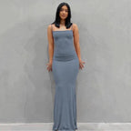 Mandotos sleek satin backless gown featuring a smooth, shiny fabric and elegant design, perfect for formal occasions.