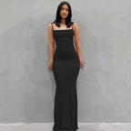 Elegant black satin backless gown by MANDOTOS featuring a sleek design and flowing fabric for formal occasions.