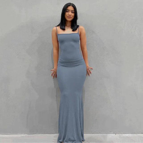 Mandotos sleek satin backless gown featuring a smooth, shiny fabric and elegant design perfect for formal occasions.