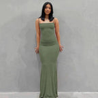 Mandotos sleek satin backless gown featuring a smooth, shiny fabric and elegant design, perfect for formal occasions.