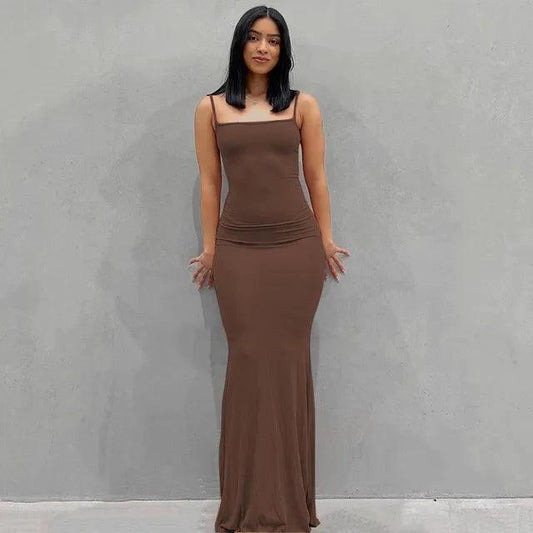 Mandotos sleek satin backless gown featuring a fitted silhouette and elegant design, perfect for formal occasions.