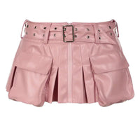 Mandotos Spice faux leather pleated mini skirt with a high waist and sleek design, shown on a model.
