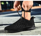 Mandotos Sports Flying Woven Cold Sticky Ultralight Casual Running Shoes showing woven fabric upper and sleek athletic design