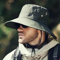 Mandotos sun-safe stylish bucket hat in neutral color with wide brim, perfect for outdoor sun protection and casual wear.