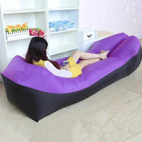 Mandotos SunScape Inflatable Lounger in vibrant orange with built-in pillow for comfortable outdoor relaxation.