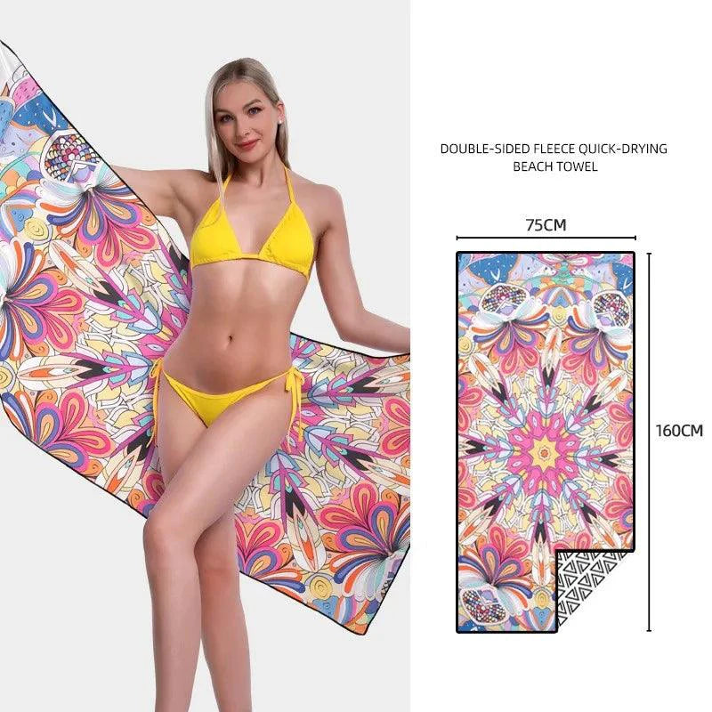 Mandotos SwiftDry patterned beach towel featuring vibrant, colorful geometric designs perfect for seaside relaxation.