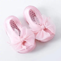 Close-up of MANDOTOS toddler shoes showing soft fabric and Velcro straps, designed for comfort and easy wear for little kids.