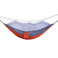 Mandotos Traveler's Mosquito-Free Hammock with netting, lightweight and portable for outdoor camping and relaxation.